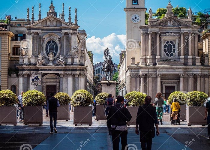 Piazza San Carlo Photo of People Walking Down a Street Surrounded by Towering ... photo